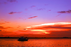 dramatic cool and warm colored sunset at manila bay philippines.